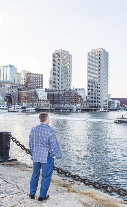 Michael Klein looking over river at skyline